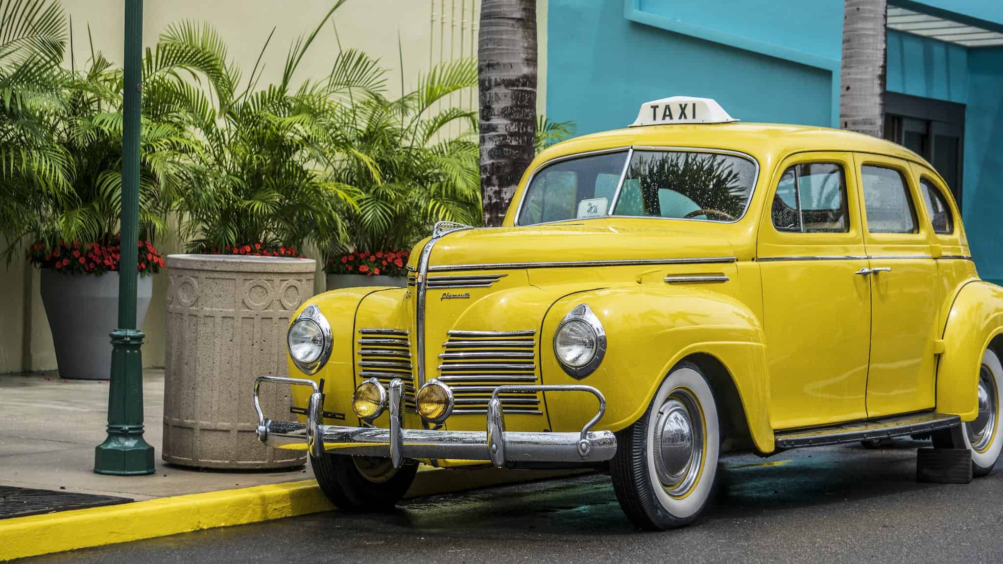 Photo of Yellow Taxi Parked Near Sidewalk